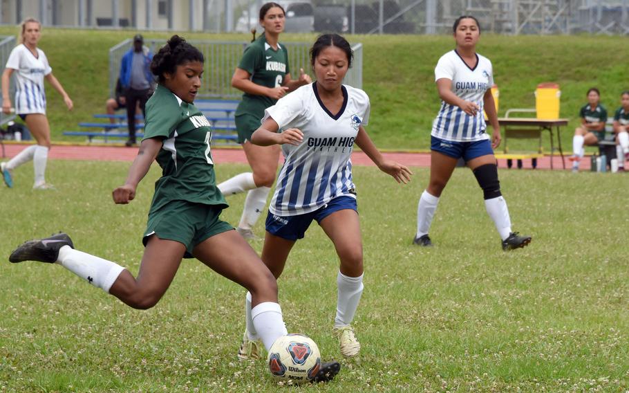 Kubasaki's Solares Solano boots the ball past Guam High's Jada Alcantara.