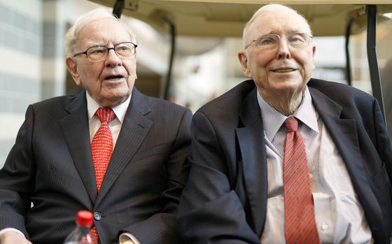File - Berkshire Hathaway Chairman and CEO Warren Buffett, left, and Vice Chairman Charlie Munger, briefly chat with reporters May 3, 2019, one day before Berkshire Hathaway's annual shareholders meeting in Omaha, Neb. Berkshire Hathaway says Munger, who helped Warren Buffett build an investment powerhouse, has died.