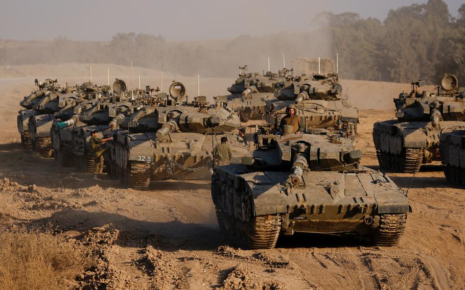 An Israeli soldier stands in a tank amid the ongoing conflict between Israel and Hamas near the Israel-Gaza border in Israel, June 4, 2024. 