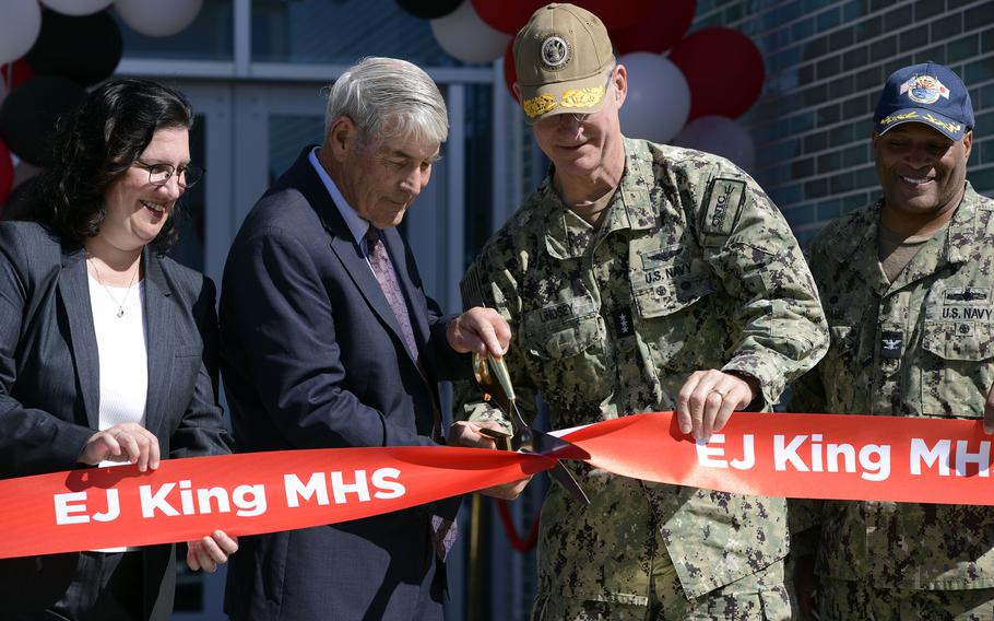 Department of Defense Education Activity director Thomas Brady and the commander of Navy Installations Command, Vice Adm. Yancy Lindsey, cut a ribbon to open the new and improved E.J. King Middle High School at Sasebo Naval Base, Japan, Wednesday, Sept. 21, 2022. 