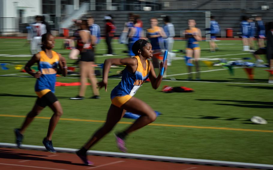 Wiesbaden runners hand off the baton during the 4x400-meter relay run at the Kaiserslautern Track and Field Invitational on Saturday, April 16, 2022, in Kaiserslautern, Germany. 