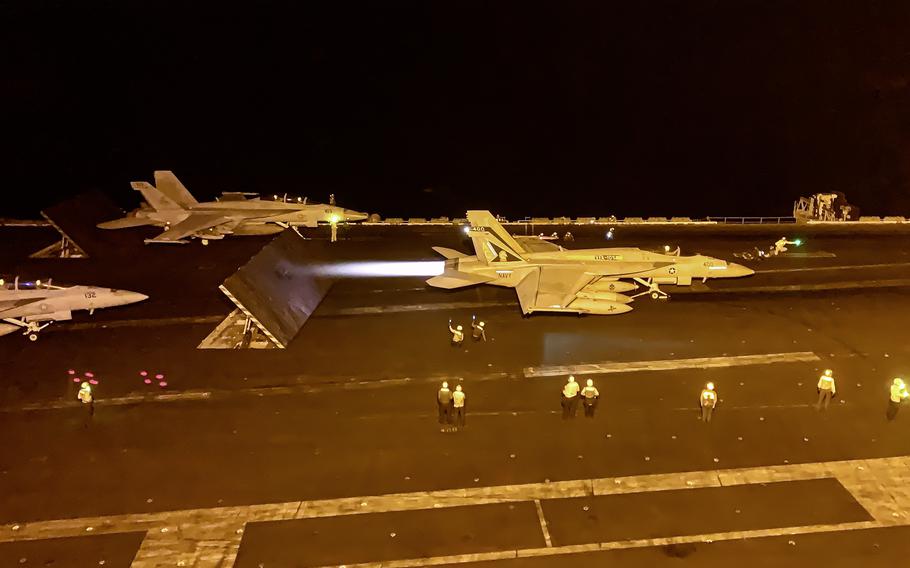 An F/A-18 Super Hornet launches during night flight operations on the aircraft carrier USS Dwight D. Eisenhower  on March 19, 2024. The planes carry out reconnaissance, defensive and other missions.