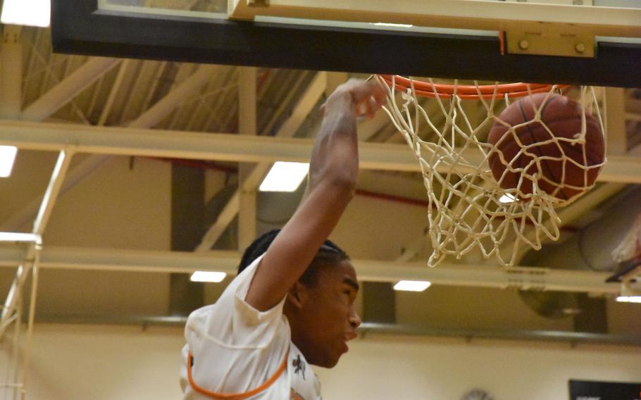 Spangdahlem senior Robert Leggett slams in two of his game-high 26 points in the Sentinels’ Division III semifinal win over five-time defending champion Baumholder in the DODEA European Basketball Championships in Wiesbaden, Germany on Friday, Feb. 16, 2024.