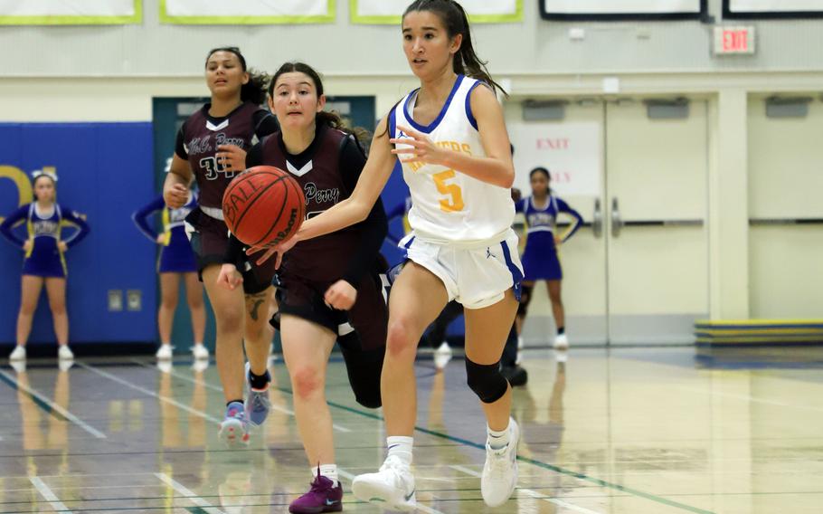 Erica Haas dribbles up the court.