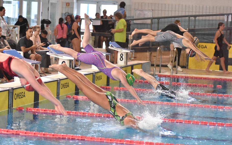 Swimmers dive into the pool to start an 800-meter freestyle heat at the European Forces Swim League Long Distance Championships on Saturday, Nov. 26, 2022, at Lignano Sabbiadoro, Italy.