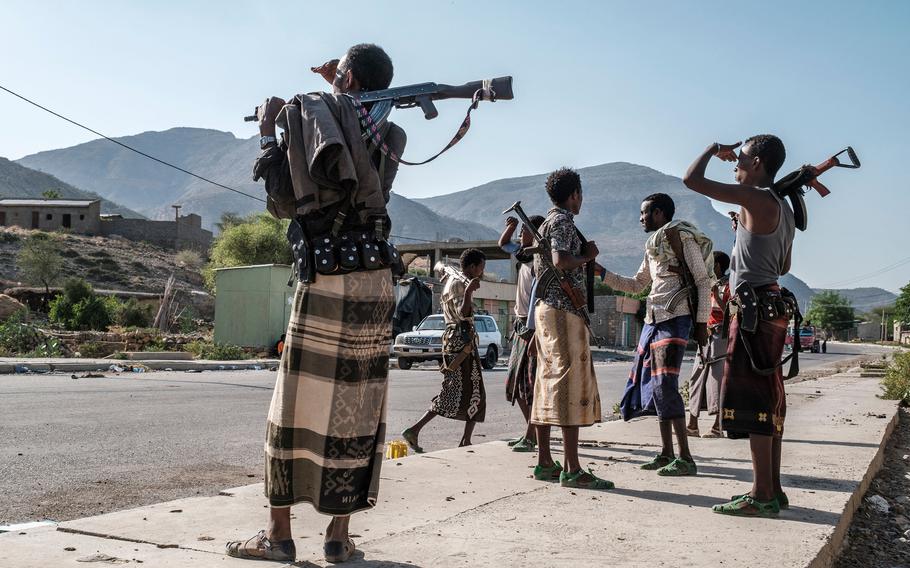 Members of the Afar militia stand in a checkpoint at the entrance of the town of Abala, 480 kilometers of Semera, Ethiopia, on June 8, 2022. The Afar region, the only passageway for humanitarian convoys bound for Tigray, is itself facing a serious food crisis, due to the combined effects of the conflict in northern Ethiopia and the drought in the Horn of Africa which have notably caused numerous population displacements. 