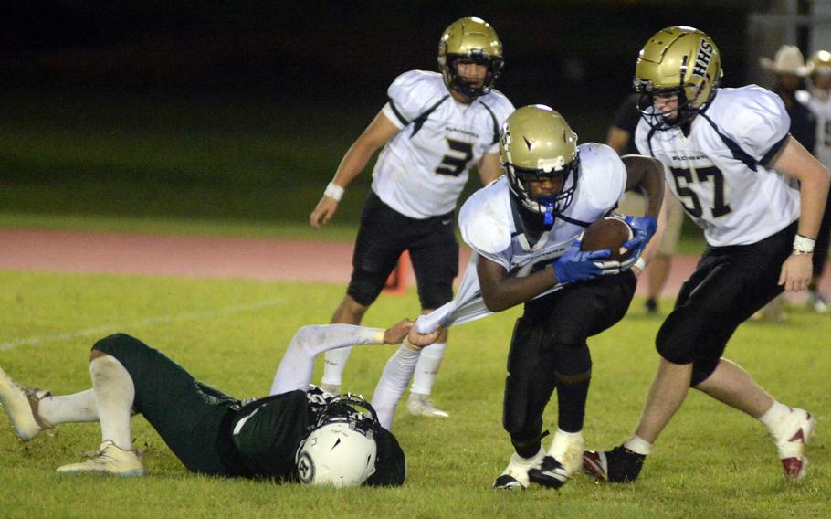 Mateo Solano makes the tackle from the ground.