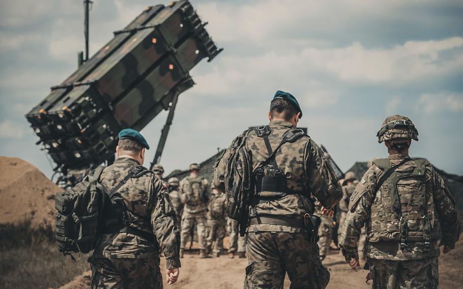 American and Polish military personnel approach a Patriot missile site near Drawsko Pomorskie, Poland, in 2018. 