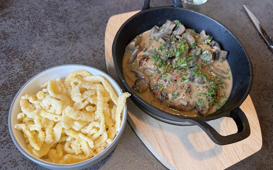 A pork cutlet lathered in a mushroom cream sauce with homemade spätzle.
