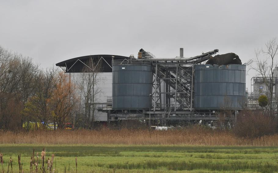 Emergency services attend to a large explosion at a warehouse in Bristol, England, Thursday Dec. 3, 2020. A local British emergency services department says there have been “multiple casualties” following a large explosion at a warehouse near the southwest England city of Bristol. (Ben Birchall/PA via AP)