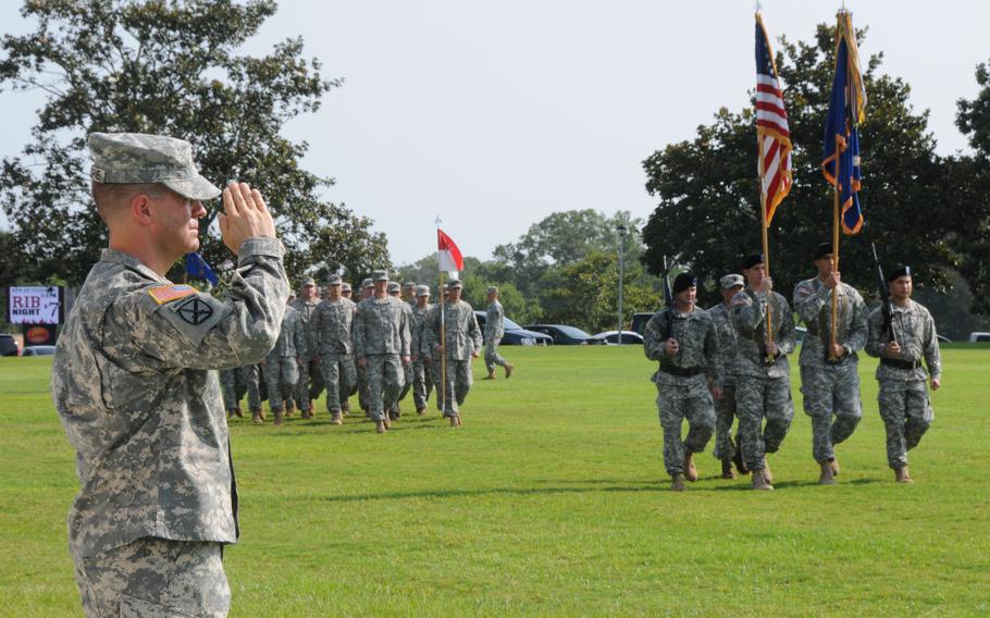 U.S. Army Lt. Col. Mark C. Gillespie salutes a pass in review during the change of command ceremony at Fort Rucker, Ala., June 28, 2013. 