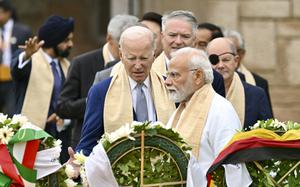 U.S. President Joe Biden, center, Indian Prime Minister Narendra Modi, and other G20 leaders arrive to pay their tributes at the Rajghat, a Mahatma Gandhi memorial, in New Delhi, India, Sunday, Sept. 10, 2023. (AP Photo/Kenny Holston, Pool)