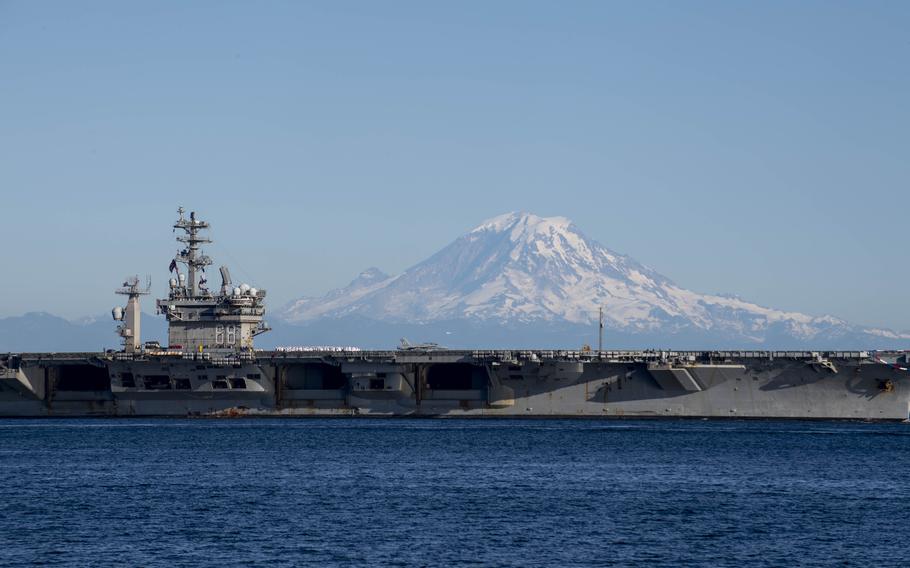 The aircraft carrier USS Nimitz (CVN 68) transits the Puget Sound on the way to its homeport of Bremerton, Wash., July 2, 2023.