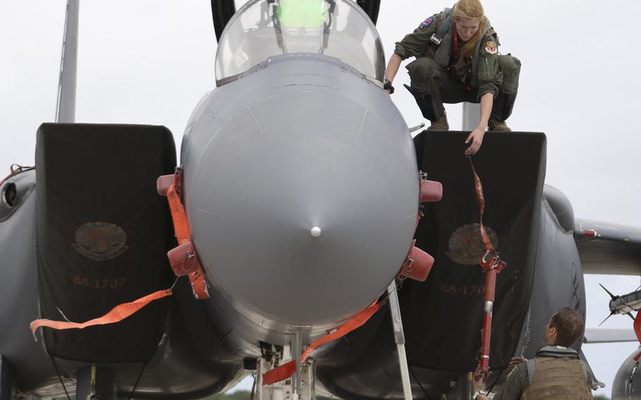 Airmen assigned to the 389th Fighter Squadron inspect an F-15E Strike Eagle after landing at Andersen Air Force Base, Guam, for the Pacific Iron exercise, July 14, 2021.