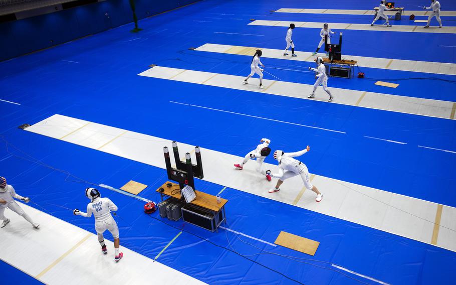 Members of the U.S. women’s Olympic fencing team practice inside the Lotus Culture Center Arena, part of the Atago Sports Complex, in Iwakuni, Japan, July 14, 2021.