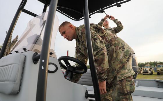 U.S. Army Pfc. Kenneth Bonn, a combat engineer with the 753rd Engineering Brigade, conducts a pre-mission inspection on a search and rescue vessel during Hurricane Ian, Camp Blanding Joint Training Center, Fla, Sept. 27, 2022. Bonn is an attached component of the Florida National Guard's Chemical, Biological, Radiological/Nuclear, and Explosive (CBRNE) - Enhanced Response Force Package (FL-CERFP). The FL-CERFP provides search and rescue capabilities during natural disasters and other emergencies. ( U.S. Army photo by Sgt. N.W. Huertas)