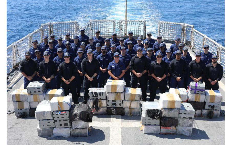 The crew of U.S. Coast Guard Cutter Reliance poses for a photo in front of approximately $52 million in illicit narcotics on the cutter’s flight deck in the Eastern Pacific Ocean, Feb. 13, 2024. Reliance returned to its homeport in Pensacola, Fla., on Saturday, Feb. 24, 2024.