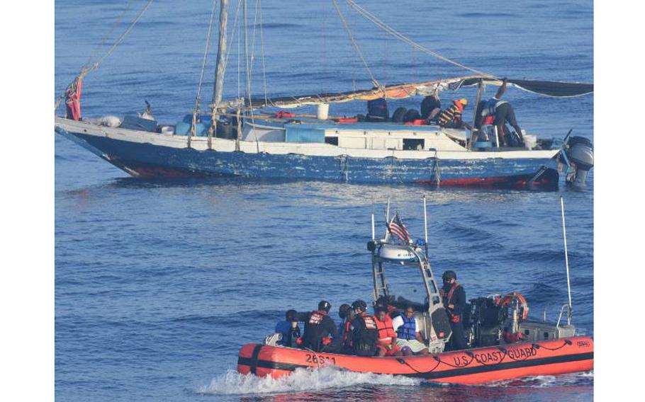 A small boat from the Coast Guard Cutter Venturous ferries Haitians voluntarily wanting to leave an unsafe vessel to the cutter, approximately 17 miles northeast of Punta Maisi, Cuba, April 9, 2022. The people were repatriated to Haiti on April 12, 2022. 