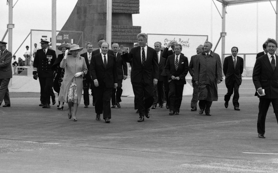 Heads of state at the 50th anniversary of the D-Day landing on Omaha Beach June 6, 1994. From left to right and visible: King Albert II of Belgium, King Harald V of Norway, Queen Beatrix of The Netherlands, Queen Elizabeth of Great Britain, French President Francois Mitterrand (with his Prime Minister Eduard Balladur behind him on the right), U.S. President Bill Clinton, Czech President Vaclav Havel, and Slovak President Michal Kovac. Visible behind Kovac is Belgium Prime Minister Jean-Luc Dehaene.
