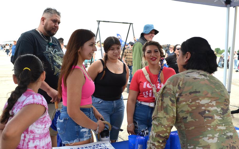 Senior Airman Jennifer Farias, a recruiter, discusses enlistment options with Arianna Garcia, 17, left, and her mother, Jessica Garcia, right, on April 6, 2024, at the Great Texas Air Show at Joint Base San Antonio-Randolph Air Force Base in Texas. Arianna said she is considering joining the Air Force after high school.