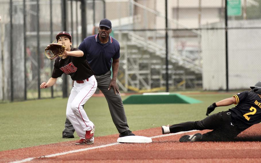 Kadena's Hajime Reed slides into third base ahead of the throw to Kinnick's Kayden Tam.