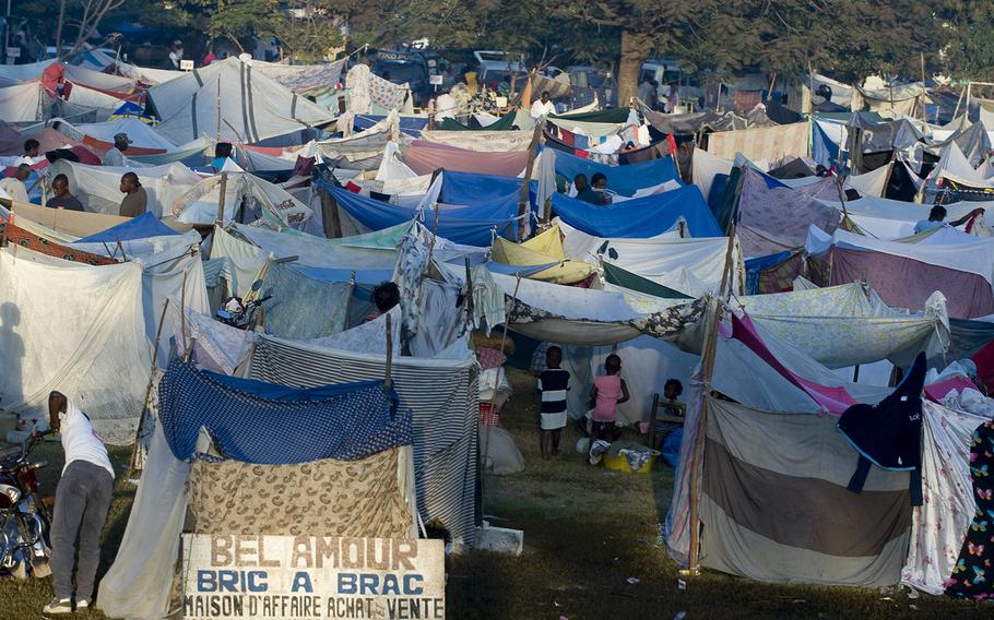 Hundreds of displaced Haitians live in make-shift homes outside Gheskio Field Hospital, located on Quisqueya University grounds, where International Medical Surgery Response Team  technicians are providing emergency medical attention to Haitians following a 7.0 magnitude earthquake near Port-au-Prince on Jan. 12, 2010. 