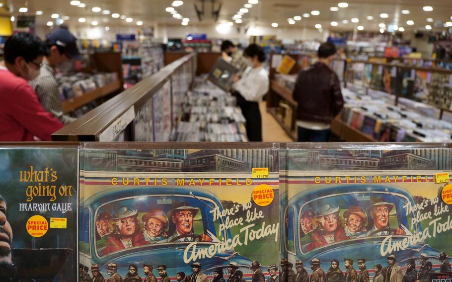 Vinyl lovers browse on the sixth floor of Tower Records in Shibuya, Tokyo, Monday, May 2, 2022.