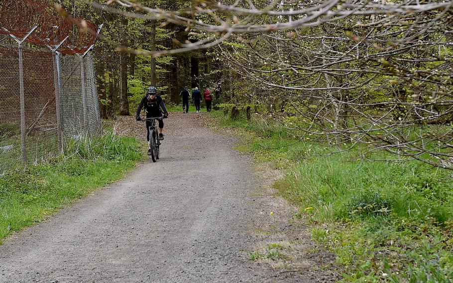 A cyclist rides toward the top of the Donnersberg near Dannenfels, Germany, on April 28, 2024. Gravel is among the trail surfaces hikers and cyclists traverse on the Donnersberg.