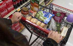FILE - Jaqueline Benitez, who depends on California's SNAP benefits to help pay for food, shops for groceries at a supermarket in Bellflower, Calif., on Feb. 13, 2023. (AP Photo/Allison Dinner, File)