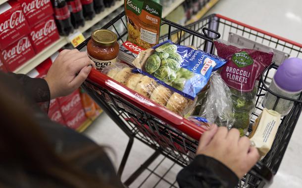 FILE - Jaqueline Benitez, who depends on California's SNAP benefits to help pay for food, shops for groceries at a supermarket in Bellflower, Calif., on Feb. 13, 2023. (AP Photo/Allison Dinner, File)