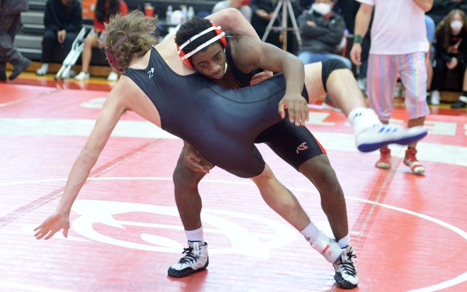 Nile C. Kinnick's Wendell Harrison sends Matthew C. Perry's Kirby Kendrick airborne at 158 pounds. Harrison won by technical fall 12-2 and took second in the weight class.