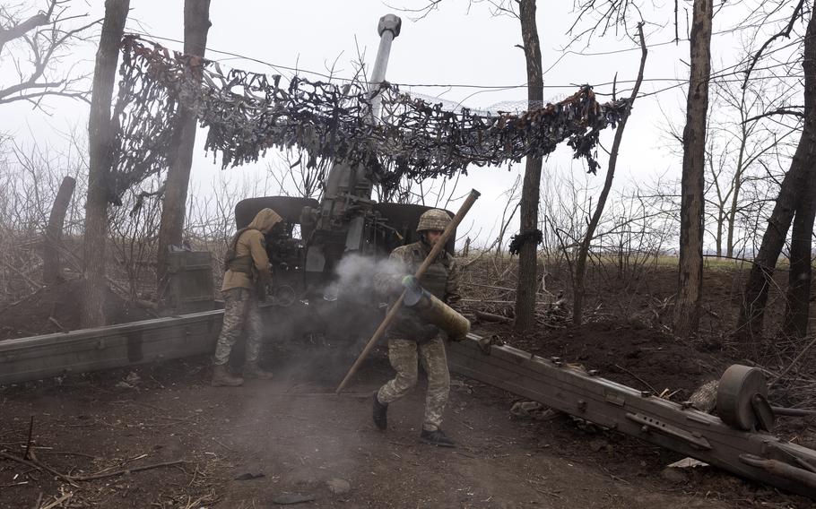 A Ukraine soldier carries away an artillery shell casing during fighting in the country’s eastern Donetsk region. Some of the leaked documents that allegedly were posted in the private space by OG offered detailed assessments of Ukraine’s defense capabilities. 