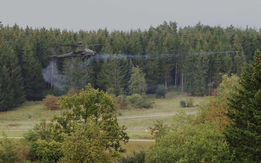 An AH-64D Apache attack helicopter fires during a live-fire aerial gunnery exercise on Grafenwoehr Training Area, Germany, Sept. 21, 2021.