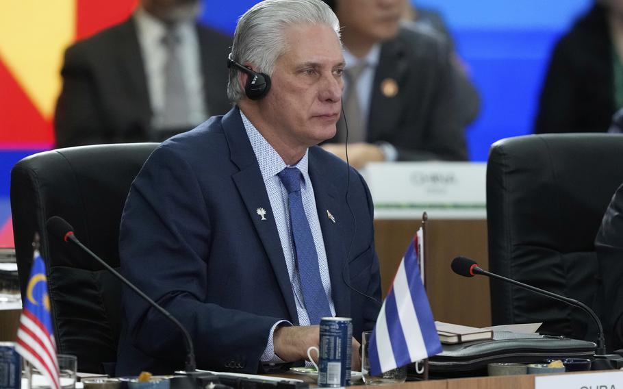 Cuban President Miguel Diaz-Canel sitting down.