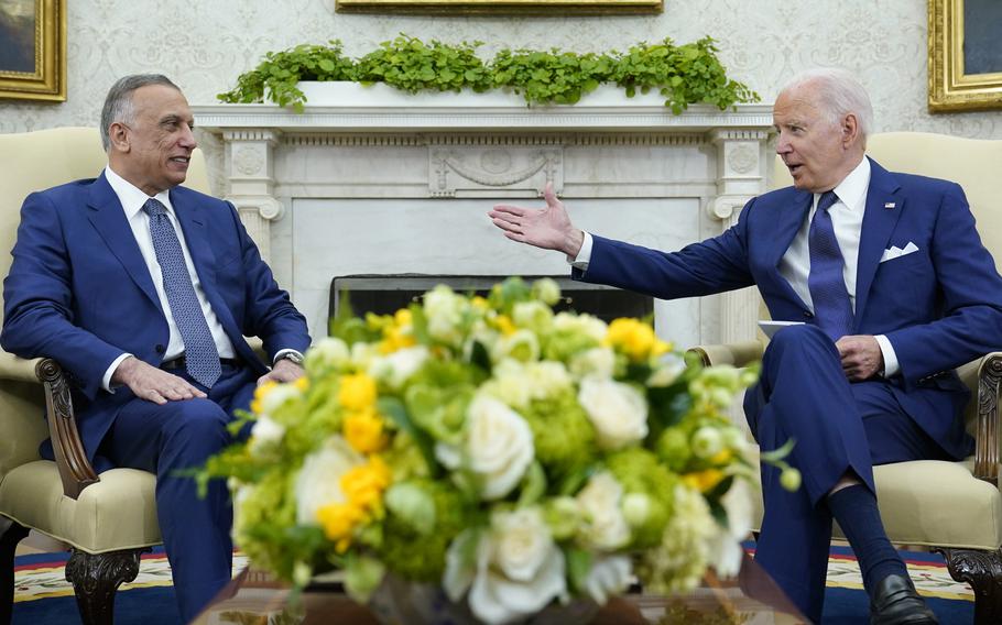 President Joe Biden, right, speaks as Iraqi Prime Minister Mustafa al-Kadhimi, left, listens during their meeting in the Oval Office of the White House in Washington, Monday, July 26, 2021.