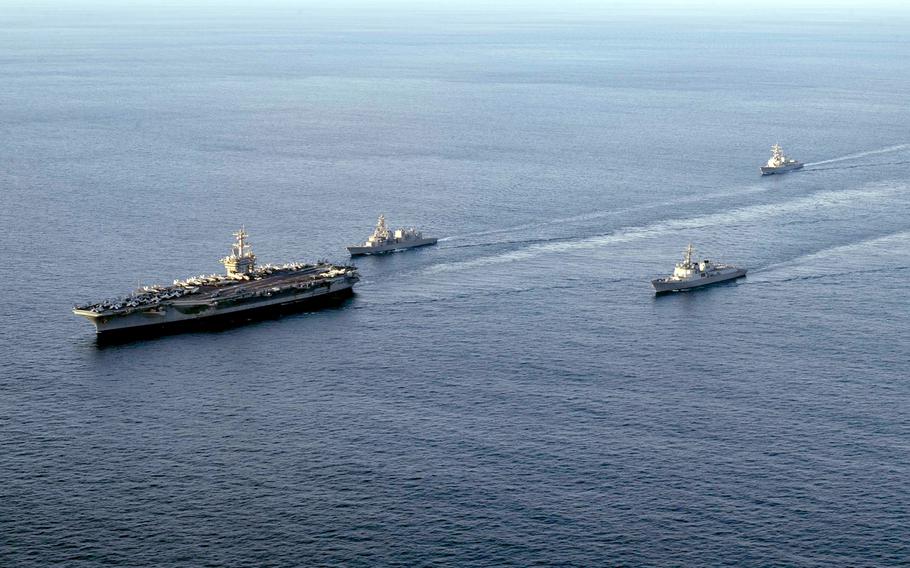 The USS Carl Vinson sets sail for a trilateral exercise south ofJeju Island, South Korea, Sunday, Nov. 26, 2023. The aircraft carrier is followed by the JS Kirisame, left, ROKS Sejong the Great, center and the USS Kidd. 