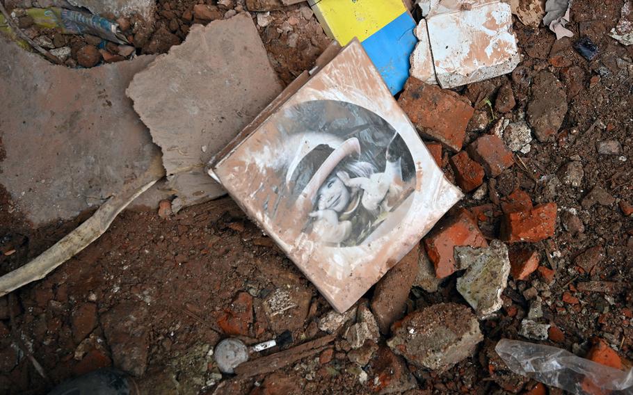 A book with a cover picture of a child,  lies on the rubble of a flat in a residential building, partially destroyed after a missile strike in Kharkiv on Jan. 30, 2023, amid the Russian invasion of Ukraine.