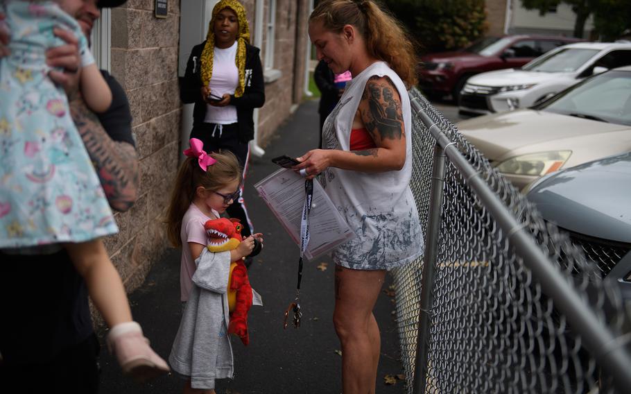 Alessa Morgan, 3, leaves her pre-school program at Begin With Us Pre-K Center in Altoona, Pa. 