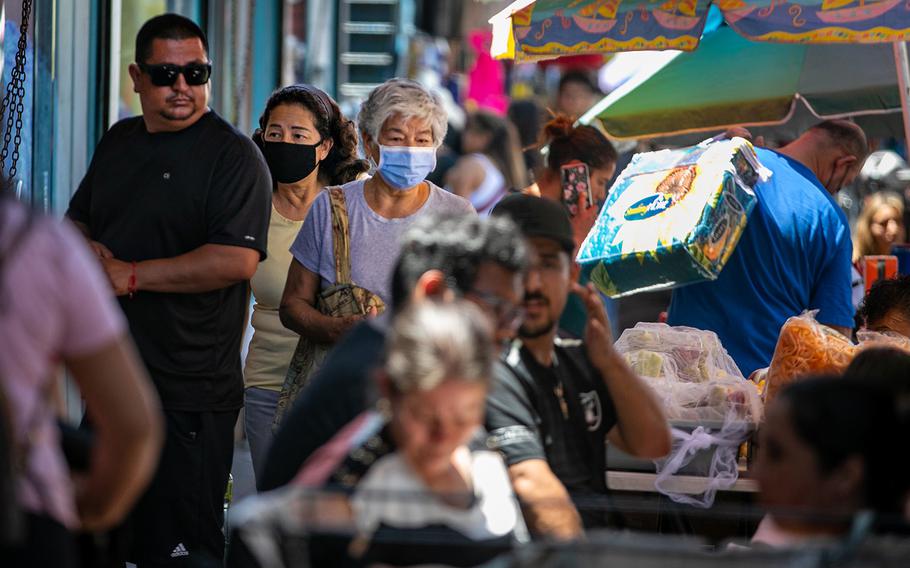 People shop and work in Santee Ally as COVID-19 numbers rise and masks may soon be mandatory again in LA County on Monday, July 11, 2022, in Los Angeles, California. 
