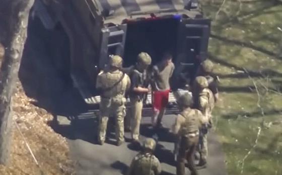 A video screen grab shows agents arresting Air Force National Guard member Jack Teixeira outside of his North Dighton, Mass., home on April 13, 2023.