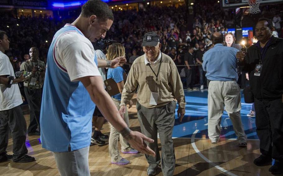 Former Kings player Mike Bibby gestures to former Kings assistant coach Pete Carril at the Sacramento Kings’ last game at Sleep Train Arena on Saturday, April 9, 2016, in Sacramento, Calif.