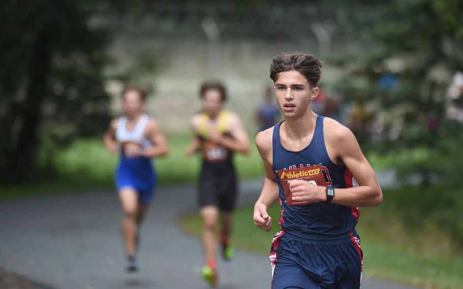 Aviano runner Ben Udall looks to separate himself from the pack during the boys 3.1-mile cross country race at Vilseck, Germany, Saturday, Sept. 10, 2022.
