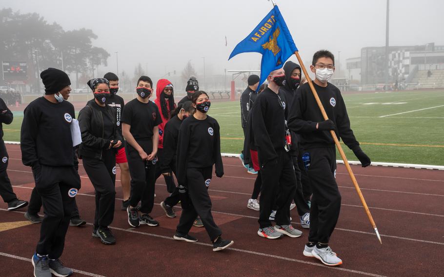 Isaac Wu, right, walks with his flight of Air Force Junior Reserve Officer Training Corps cadets during a Veterans Day march at Kaiserslautern High School on Thursday, Nov. 11, 2021. 
