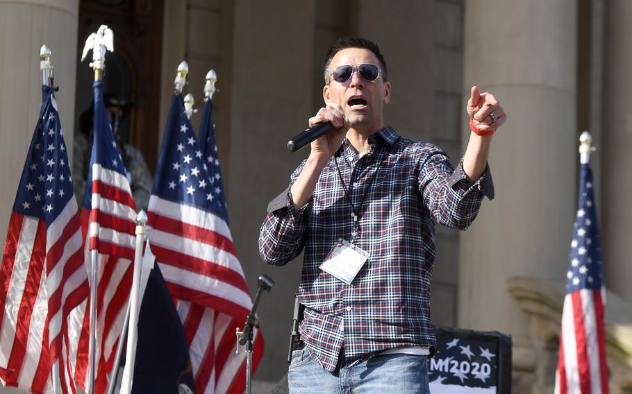 Ryan Kelley of the American Patriot Council fires up the crowd as he speaks as President Donald Trump supporters gather at the state Capitol Building  in Lansing, Michigan, for a "Stop the Steal" rally disputing the presidential election Saturday, Oct. 14, 2020. 