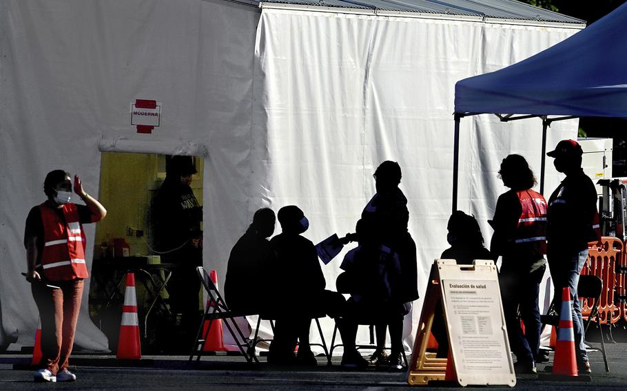 A mobile clinic offers free coronavirus vaccinations in the Lakeforest Mall parking lot in Gaithersburg, Md., on June 25, 2021. 