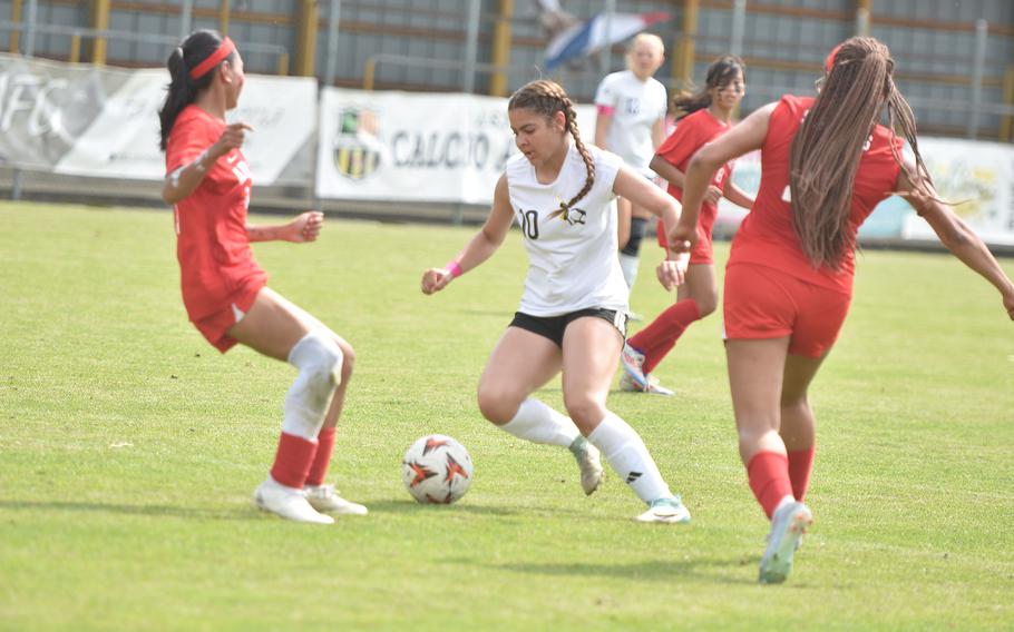 Emily Vallejo-Rodriguez splits Aviano defenders.