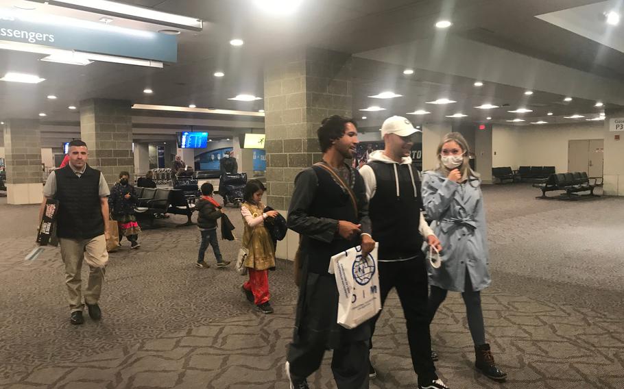 Amin Faqiry and his family arrived in Rhode Island on Oct. 30, 2021, and were met by supporters at T.F. Green International Airport.