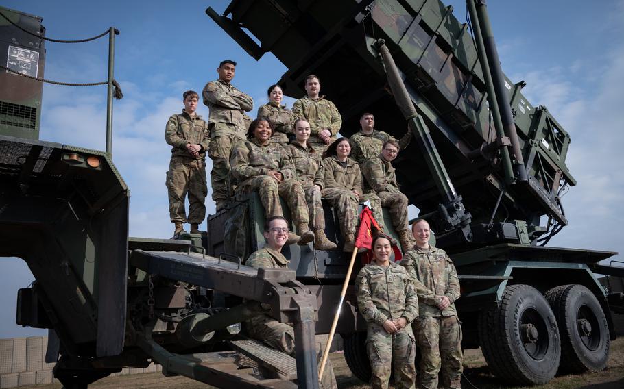 Members of Delta Battery, 5th Battalion, 7th Air Defense Artillery Regiment gather for a photo on a Patriot missile launcher in southeastern Poland on March 7, 2023. 