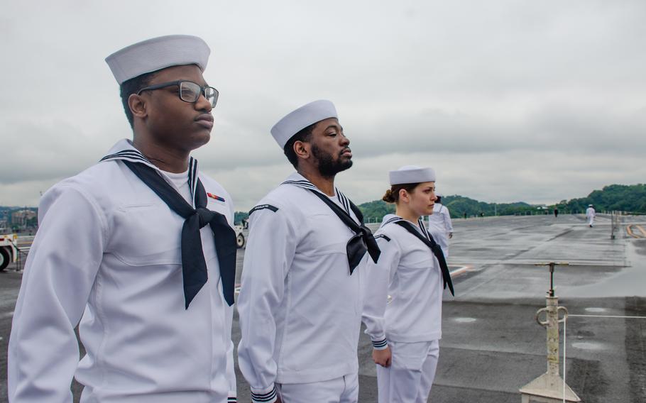 Sailors man the USS Ronald Reagan's rails as the aircraft carrier prepares to depart Yokosuka Naval Base, Japan, May 16, 2024.