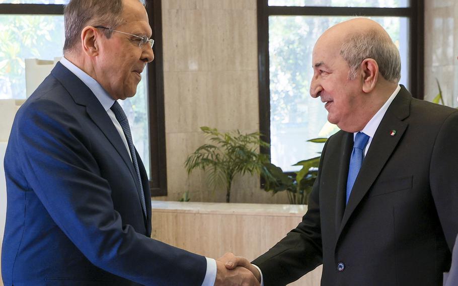 In this photo released by Russian Foreign Ministry Press Service, Algerian President Abdelmadjid Tebboune, right, greets Russian Foreign Minister Sergey Lavrov during their meeting at El Mouradia Palace, the official residence of the President, in Algiers, Algeria, on Tuesday, May 10, 2022. (Russian Foreign Ministry Press Service via AP)